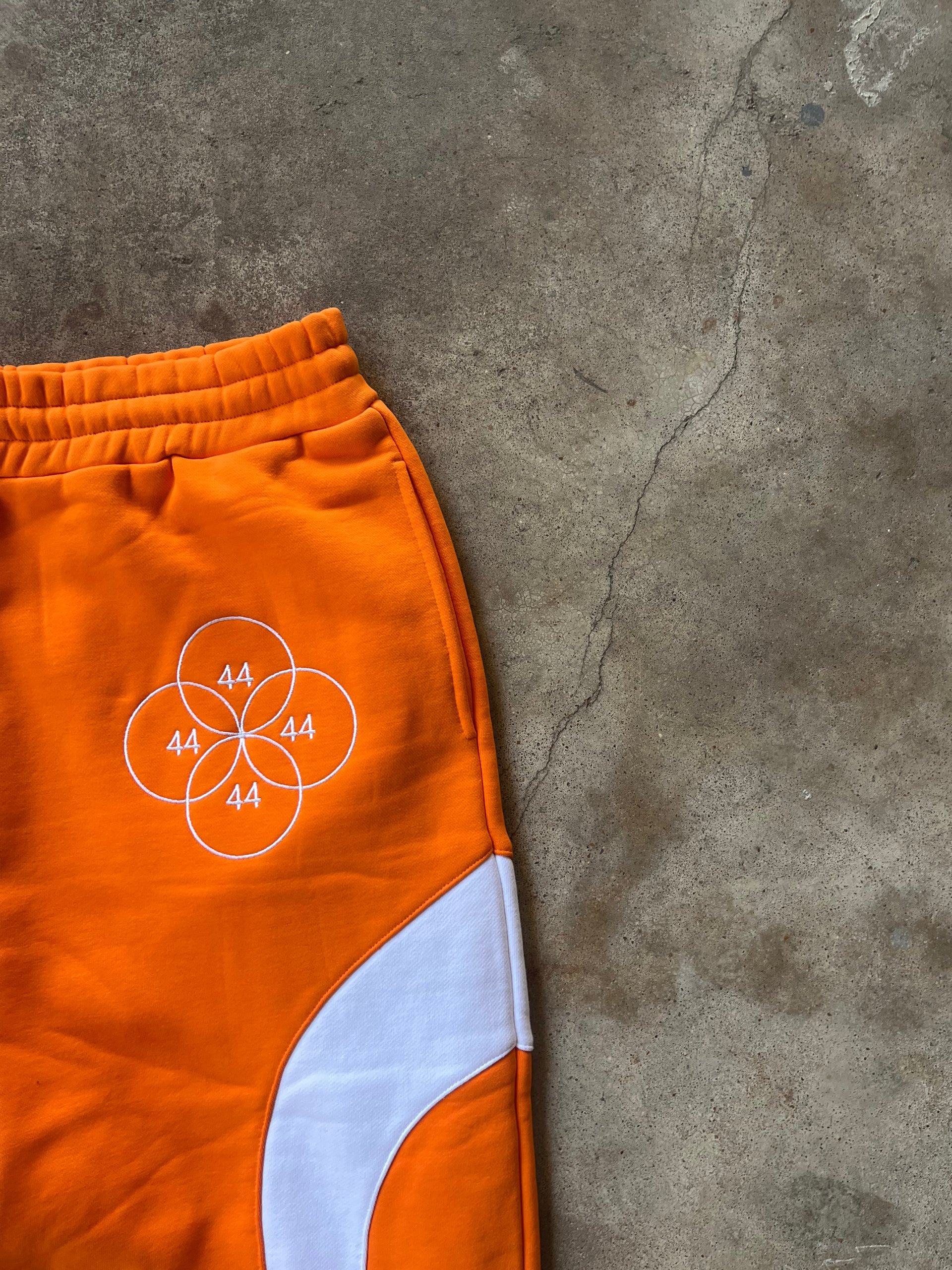 “CYCLES” EMBROIDERED SWEATPANTS - ORANGE